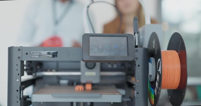 A close-up view of a 3D printer in operation, actively printing a small object using filament  and related materials. Capturing the precision and innovation of modern additive manufacturing technology