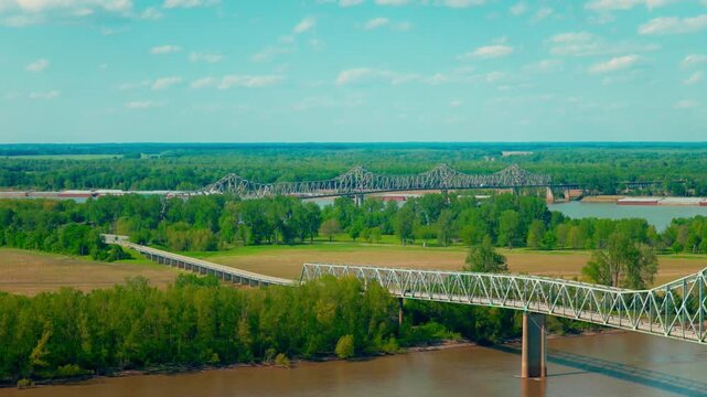 Cairo Illinois where the Ohio and Mississippi rivers converge, a historic tristate geographic landmark framed by iron bridges and lush summer floodplain.