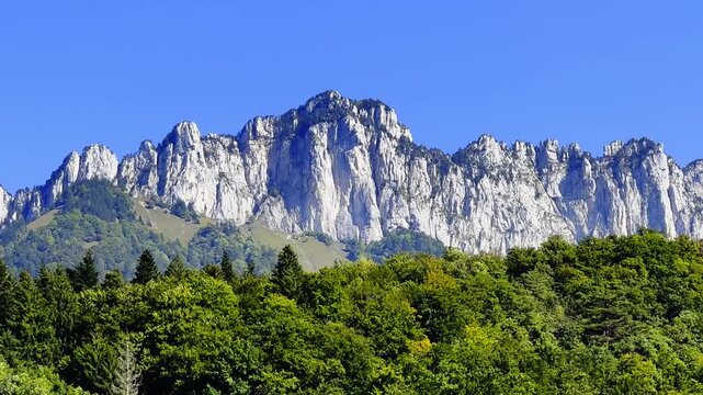 Mountain View and Forest in a Sunny Summer Day with Blue Sky in Menthon Saint Bernard, Auvergne Rhone Alpes, France.