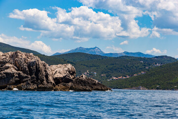 Obraz premium Expansive coastal view of the rugged Adriatic shoreline and deep blue waters near the entrance of the Herceg Novi bay