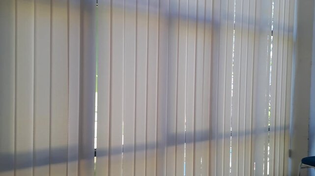 Empty indoor hall after event with stacked chairs neatly arranged. Quiet room with natural light through vertical blinds. Minimalist stock video 4K for business, conference, meeting, seminar, corporat