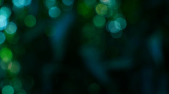 Abstract green bokeh lights with soft glow and blurred background for nature and aesthetic designs