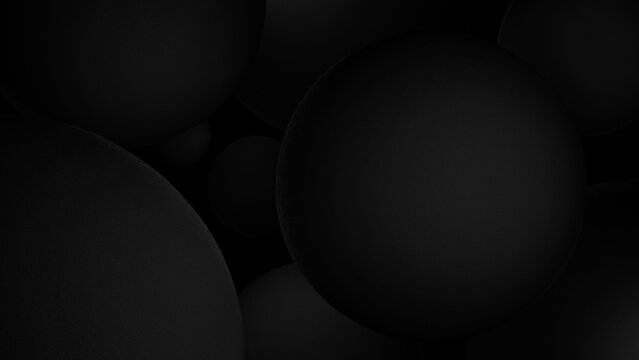 Abstract 3d render of matte black spheres in varying sizes, creating a minimalist and elegant black aesthetic. Fits for design projects, backgrounds, or artistic concepts.