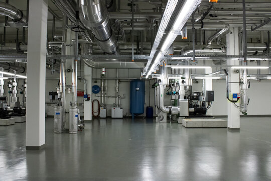 Lugano, Ticino, Switzerland - 18 March 2026: View of the Swiss National Supercomputing Centre featuring complex industrial piping and cooling infrastructure in a technical facility.