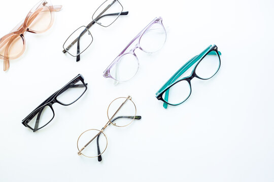 Glasses for vision on a white background in optical store. Vision test concept, stylish glasses concept
