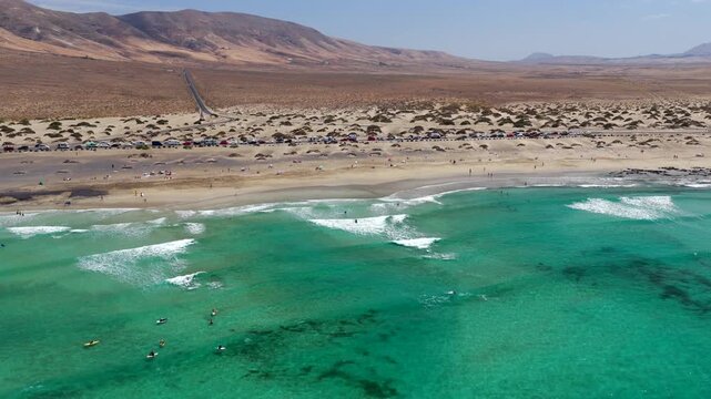 Aerial Flyover above  Famara Beach Cliffs and Coastal Village in Northwest Lanzarote