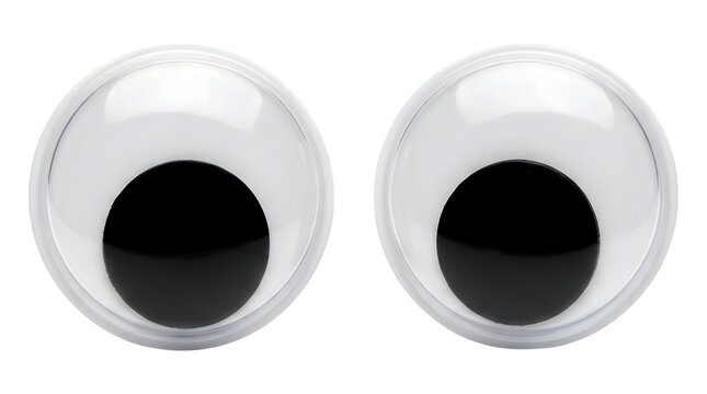 Two plastic googly eyes isolated on black background