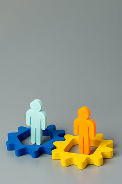 A vertical conceptual image representing teamwork, business synergy, mechanical processes, collaboration, and systemic integration.