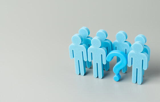 A blue question mark and a group of blue human figures. Uncertainty, anonymous teams, missing personnel, hiring queries concept. Copy space for text.