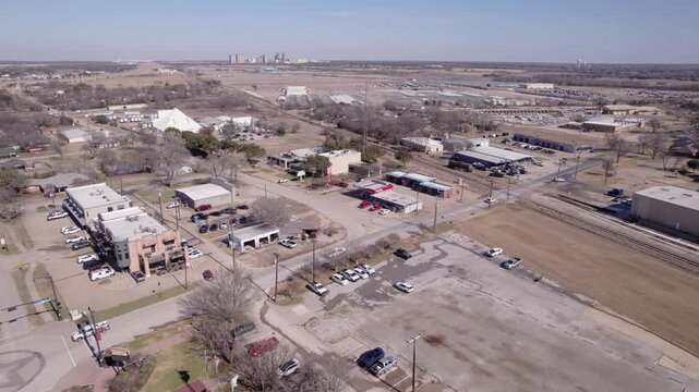 4K drone flyover of historic downtown Midlothian, Texas, capturing small-town architecture, local businesses, and North Texas community city center scenery.