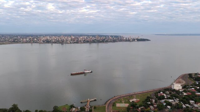 Drone view of Posadas Misiones Province Argentina seen across the Parana River from Encarnacion Paraguay.