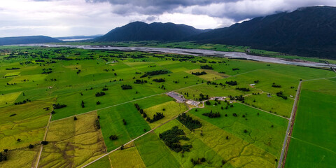 Aerial view of rivers and green pastures in the valleys, New Zealand © zhang