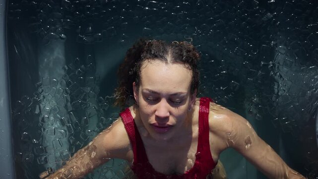 Biohacking inspires the woman in an ice bath during cold plunge recovery