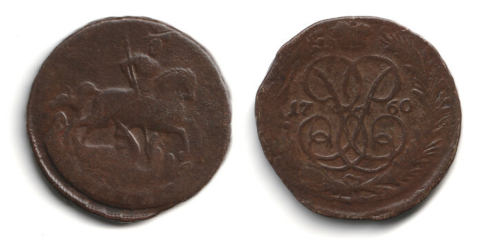 Front and back views of an old brown copper 1 kopeck coin 1757-1761 Russian Empire Elizabeth I isolated on white, showing a horse rider on one side and an ornate dated design on the other.