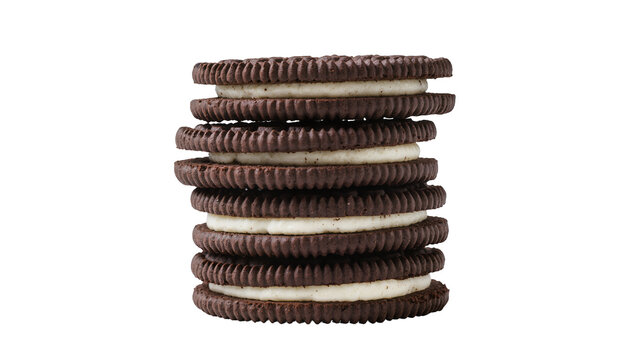 Stack of dark chocolate sandwich cookies with cream filling, isolated on transparent background