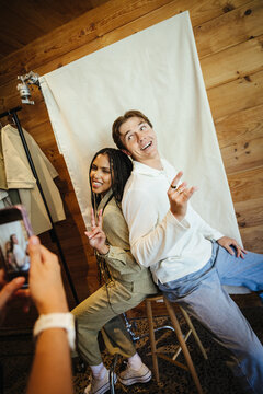 Young content creators posing during a fun photo shoot session indoors