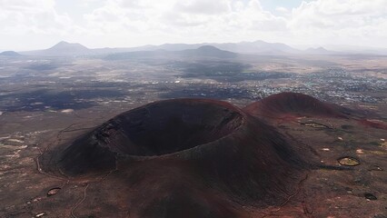 Volcano crater on mountain with surrounding landscape and sky © Georgeta