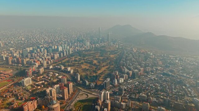 Araucano Park and Sanhattan District with Andes Mountains in Santiago de Chile Drone Aerial Establishing View