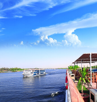 View from cruise ship on the Nile river, Egypt, Africa. Luxury Nile Cruise. Famous tourist attraction. Summer relaxing on cruise ships. Topic of travel, trip abroad on vacation, cruises and tours