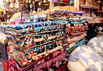 Multicolored carpets on outdoor market on Khan Al-Khalili Bazaar, Cairo, Egypt. Beautiful handmade rugs on the open market bazaar © frenta