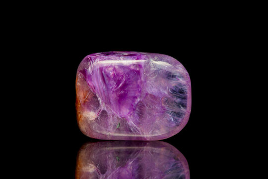 Closeup rare charoite gemstone on dark background (silicate group)(selective focus)