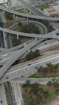 Slowly Circling Aerial View over Judge Pregerson Interchange Highway showing multiple Roads with little car traffic in Los Angeles during times of Coronavirus Covid19 Pandemic on sunny day