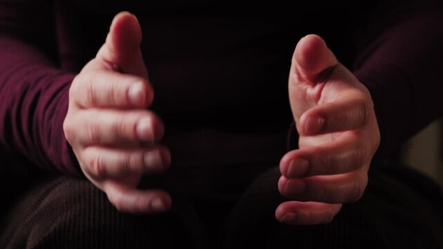 Close-up of a speakers hands gesturing during a conversation, emphasizing emotion and engagement in communication. High quality 4k footage