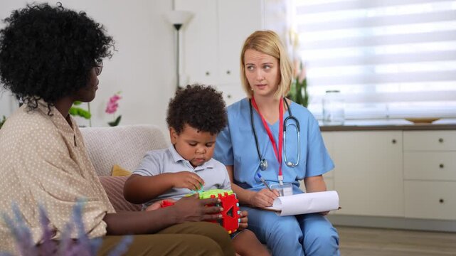 Nurse attentively listening to mother during home visit