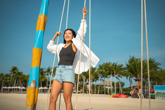 Carefree traveler feeling secure and protected while enjoying a dream vacation at a tropical beach
