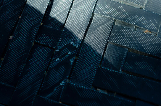 Close up of woven black straps creating a textured pattern providing a detailed background suitable for design elements