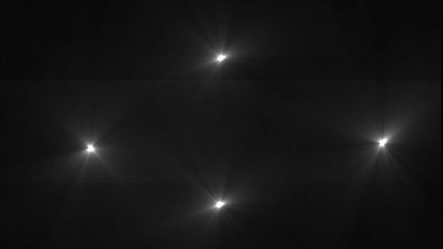 Abstract Bright White Spotlight Optical Lens Flare Animation With Glowing Rays Of Light Flashing On Black Background Loop