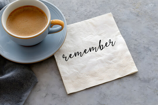 A napkin was placed near a cup of coffee, alongside which was the reminder "remember"