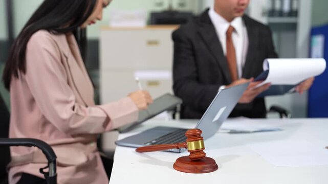 Business lawyer meeting working with paperwork on desk in office workplace for consultant lawyer in office.