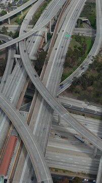 Slowly Circling Aerial View over Judge Pregerson Interchange Highway showing multiple Roads with little car traffic in Los Angeles during times of Coronavirus Covid19 Pandemic on sunny day