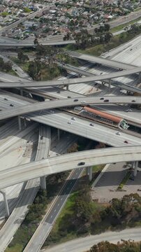 AERIAL: Spectacular Judge Pregerson Interchange showing multiple Roads, Bridges, Highway with little car traffic in Los Angeles, California on Beautiful Sunny Day 