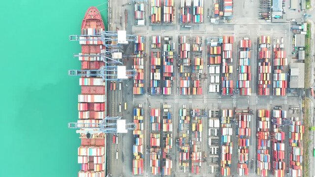 Numerous Containers Line Busy Dockside Port Infrastructure Alongside Turquoise Sea at Global Shipping Terminal with Cargo Containers and Maritime Trade Operations-dynamic view of international trade l