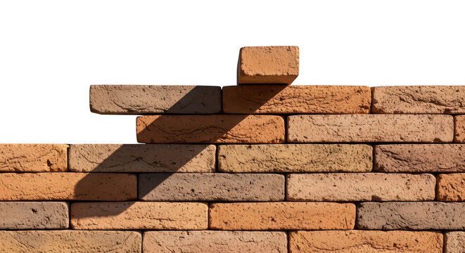 Red brown brick wall being built with a single brick placed on top during a sunny bright day isolated on transparent background