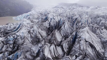 Close-up of rocky mountain terrain with cracks and crevices © Ionela