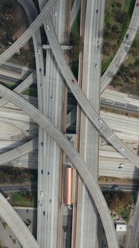 AERIAL: Spectacular Overhead Shot of Judge Pregerson Highway showing multiple Roads, Bridges, Highway with little car traffic in Los Angeles, California on Beautiful Sunny Day 