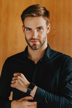 Vertical shot businessman with serious face confident in modern office, corporate professional portrait, leadership, decision making, success mindset and executive lifestyle concept