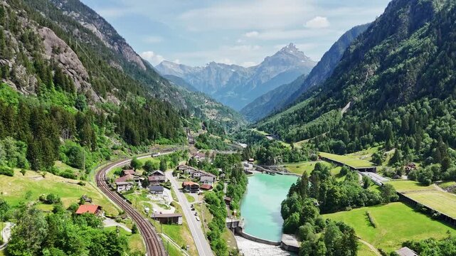 Aerial View of Wassen Valley with Railway, Road, and Reservoir