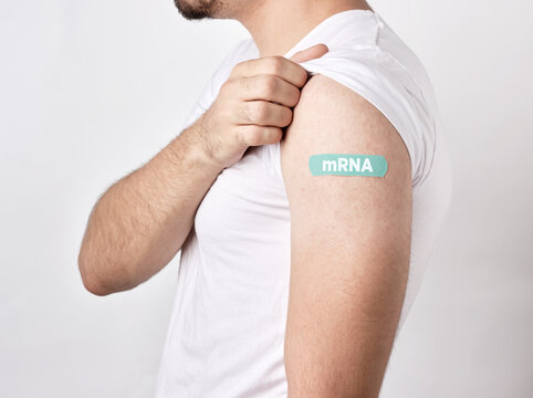 Man showing mRNA bandage after vaccine injection