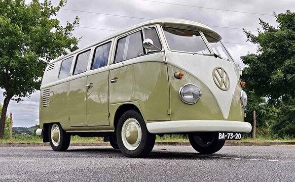 Volkswagen Type 2 vintage microbus parked on asphalt road