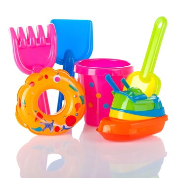 Colorful Plastic Beach Toy Set Arranged on White Background