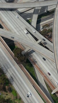 Slowly Circling Aerial View over Judge Pregerson Interchange Highway showing multiple Roads with little car traffic in Los Angeles during times of Coronavirus Covid19 Pandemic on sunny day