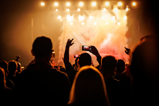Concert Crowd Silhouette Watching Live Music Show and Phone