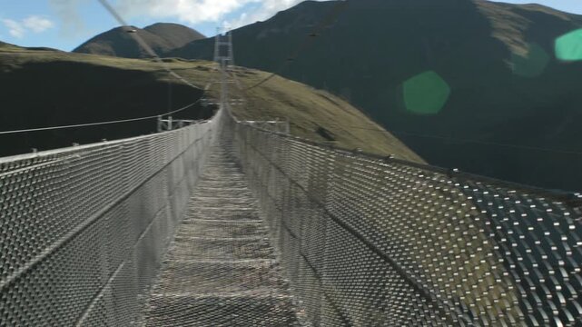 Touring the impressive Tinco suspension bridge in Peru.