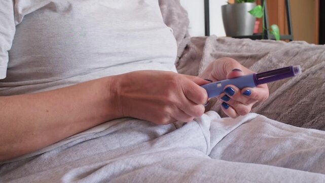 Diabetic woman using semaglutide pen at home