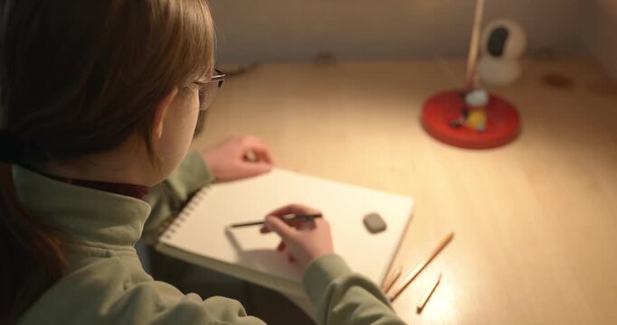 Girl Draw Pictures With Pencil on Desk Table in Bedroom at Home. 4K 10-bit