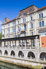 Fototapeta premium Historic Kresija Palace at the river in Ljubljana, Slovenia